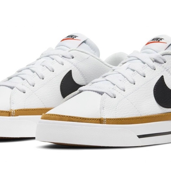 Nike Shoes - Nike White Sneakers with Black Swoosh and Gold Accent